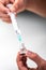 Coronavirus COVID-19 vaccine and injection syringe in hand of do