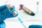 Coronavirus COVID-19 vaccine vial and injection syringe in medic hands concept