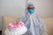 Coronavirus. doctor delivering birthday cake to a young woman infected with the coronavirus