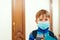 Coronavirus epidemic. Boy with protection mask. Kid in school. Face mask against: virus, ill, epidemic, flu. A child wearing a
