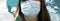 coronavirus global fight -woman wearing surgical mask and world map