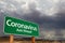 Coronavirus Green Road Sign Against Ominous Stormy Cloudy Sky