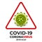 Coronavirus icon in red prohibitive triangular sign. Danger of infection covid-19 novel coronavirus bacteria.