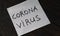 Coronavirus inscription sticker on black board