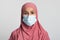 Coronavirus And Islam. Religious Muslim Woman In Hijab Wearing Protective Medical Mask