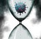 A coronavirus is isolated inside an hourglass