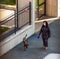 Coronavirus Italy in quarantine woman in street with mask and dog