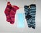 Coronavirus laundry: Medical facemask on a clothesline between two pairs of colourful socks