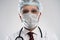 Coronavirus. Male doctor man in white medical gown sterile face mask gloves isolated