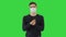 Coronavirus Man wearing protective mask cleaning his hands with sanitizer on a Green Screen, Chroma Key.