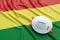 Coronavirus medical surgical face mask on the Bolivian national flag