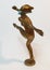 Coronavirus metaphore vintage brass statue dancer girl