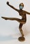 Coronavirus metaphore vintage brass statue dancer girl