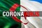 Coronavirus Monitor on Algeria flag background. Coronavirus hazard and Infection in Algeria concept. 3D rendering Corona virus