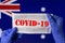 Coronavirus outbreak. Coronavirus update in Australia. Word Covid-19 on medical mask with australian flag on background.