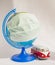 Coronavirus outbreak. World pandemia. Globe in medicine mask and travel bus on white background. Concept of traveling while covid-