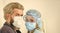 Coronavirus pandemic outbreak preventions. stay at home. man and doctor in respirator mask. Couple in love. protect your