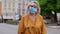 Coronavirus pandemic, portrait of senior stylish tourist man grandmother wearing protective mask