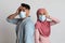 Coronavirus Panic. Worry Muslim Couple In Medical Masks Touching Heads In Shock