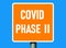 Coronavirus phase 2 warning sign in road and traffic sign style