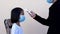 Coronavirus protect and social distancing concept, close up kids checking body temperature by infrared thermometer in hand