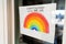 Coronavirus Rainbow campaign painting hanging at home window to spread positivity with message EVERYTHING WILL BE OK in