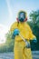 Coronavirus. A sanitation worker wearing a mask and cleaning the streets. Sterilize urban decontaminate city. Disinfecting against