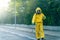 Coronavirus. A sanitation worker wearing a mask and cleaning the streets. Sterilize urban decontaminate city. Disinfecting against