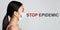 Coronavirus spread hazard. Young Asian girl wearing medical mask and phrase STOP EPIDEMIC on grey background, collage