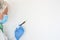 Coronavirus. A syringe containing the covid-19 coronavirus vaccine in the hand of sanitary worker. Copy space on white background