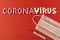 Coronavirus. Thermometer, medical protective mask and the inscription coronavirus tablets on a red background. The concept of