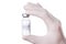 Coronavirus treatment concept. Close-up macro cropped photo of doctor holding a vial of COVID-19 water transparent vaccine
