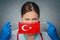 Coronavirus in Turkey Female Doctor Portrait hold protect Face surgical medical mask with Turkey National Flag. Illness, Virus