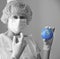 Coronavirus vaccination with woman doctor and syringe with globestock photo