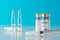 Coronavirus vaccine vial glass with a syringe on blue background.  Covid-19 medicine vaccination concept. World pandemic concept