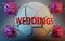 Coronavirus and weddings, symbolized by viruses destroying word weddings to picture that Covid-19 pandemic affects weddings in a