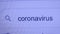 Coronavirus is written in the search bar with the cursor and the magnifying glass symbol. Concept of pandemic, safety, prevention