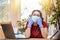 Coronavirus.A young woman in a medical mask and gloves, leaning on her hands with boredom and looking lazy.Home environment.