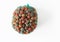 Corozo fruit in a mesh on white background. Bactris guineensis. Space to copy
