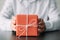 Corporate birthday party red paper gift box hands