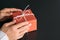 Corporate birthday party red paper gift box hands