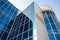 Corporate buildings, modern office building with glass windows and blue sky in the morning. High-rise, skyscrapers with