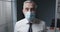 Corporate businessman wearing a surgical mask