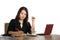 Corporate company portrait of young beautiful and busy Asian Chinese business woman working at office computer desk concentrated i