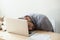 Corporate employee sleeping on his laptop keyboard after deadlin