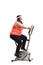 Corpulent woman exercising on a stationary bike