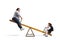 Corpulent woman playing on a seesaw with a schoogirl