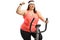 Corpulent young woman riding a stationary bike and gesturing win