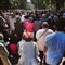 Corpus Christi Day. Crowd people during procession. Artistic look in vintage vivid colours.