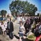 Corpus Christi Day. Crowd people during procession. Artistic look in vintage vivid colours.